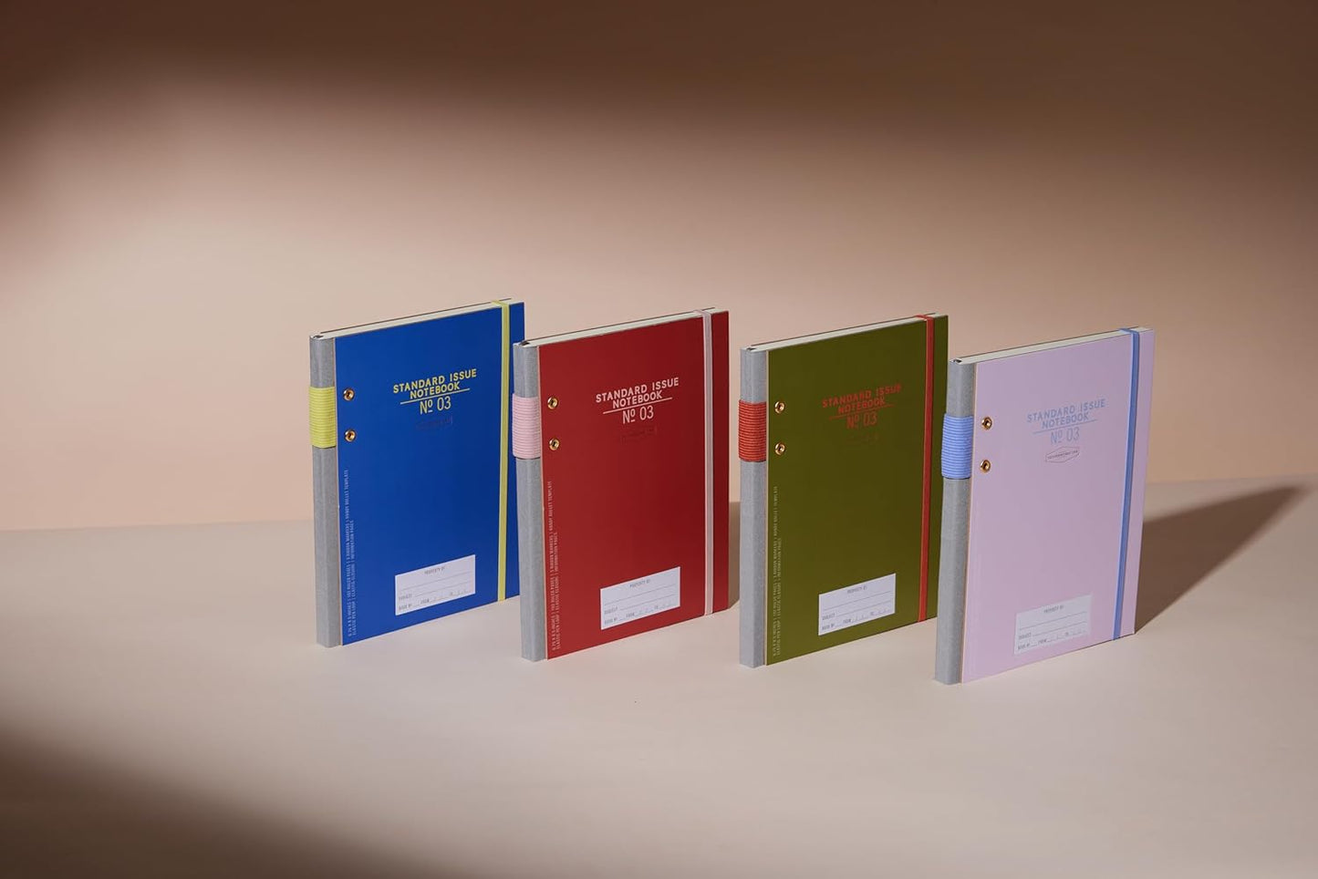 DesignWorks Ink Standard Issue Planner Notebook No. 3 Journal with Lined Pages, Elastic Closure, Pen Holder, and 3 Ribbon Markers for Work, Writing, Journaling - 6.75" x 8.5"