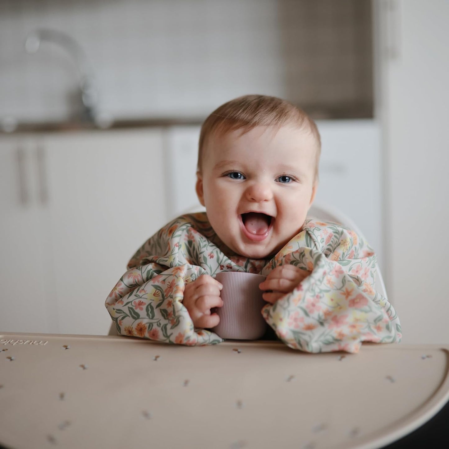 mushie Long Sleeve Baby Bib | Water Resistant Adjustable Fit for Ages 6-24 Months