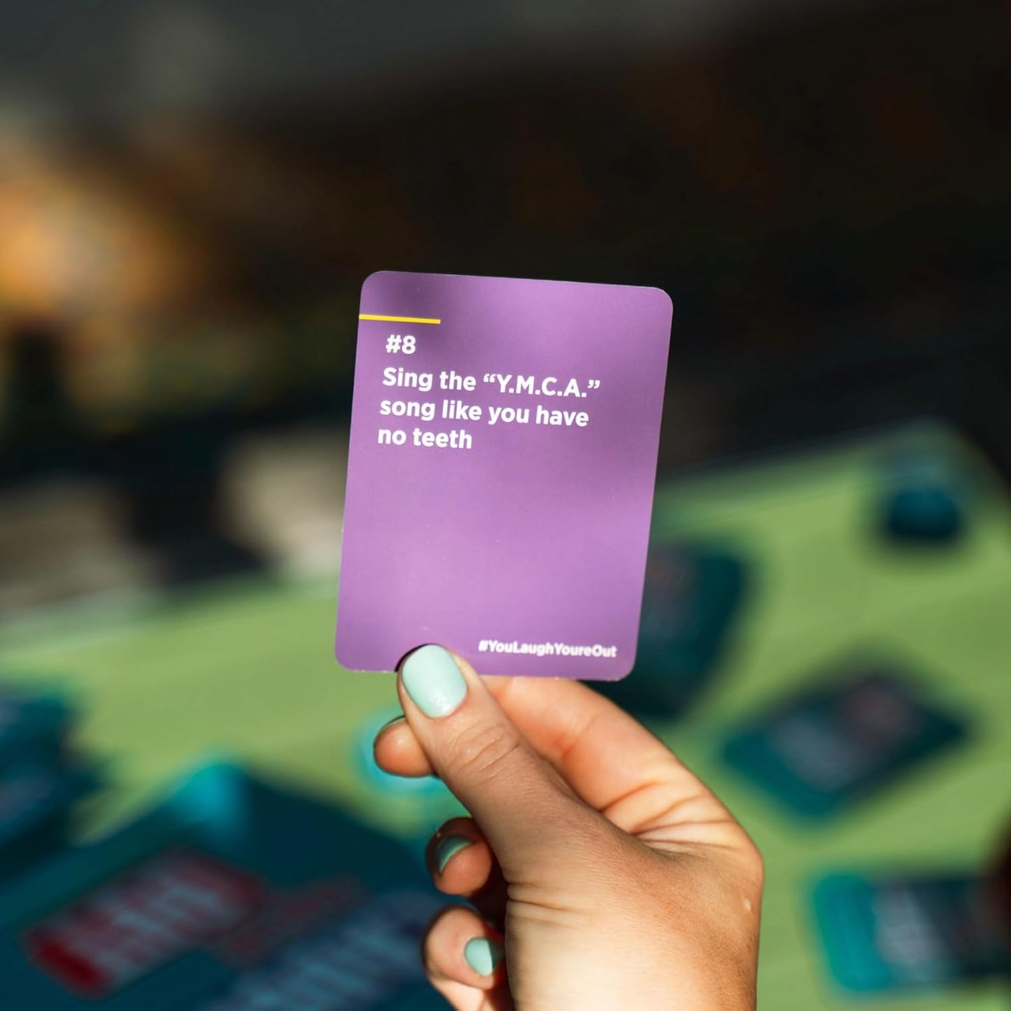 You Laugh You're Out [A Party Game with Hilarious Charades Family Card Games for Adults & Teens, 125 Prompt Cards Fun for Family Game Nights, Easter Basket Stuffers, Gatherings, & Parties Ages 14+]