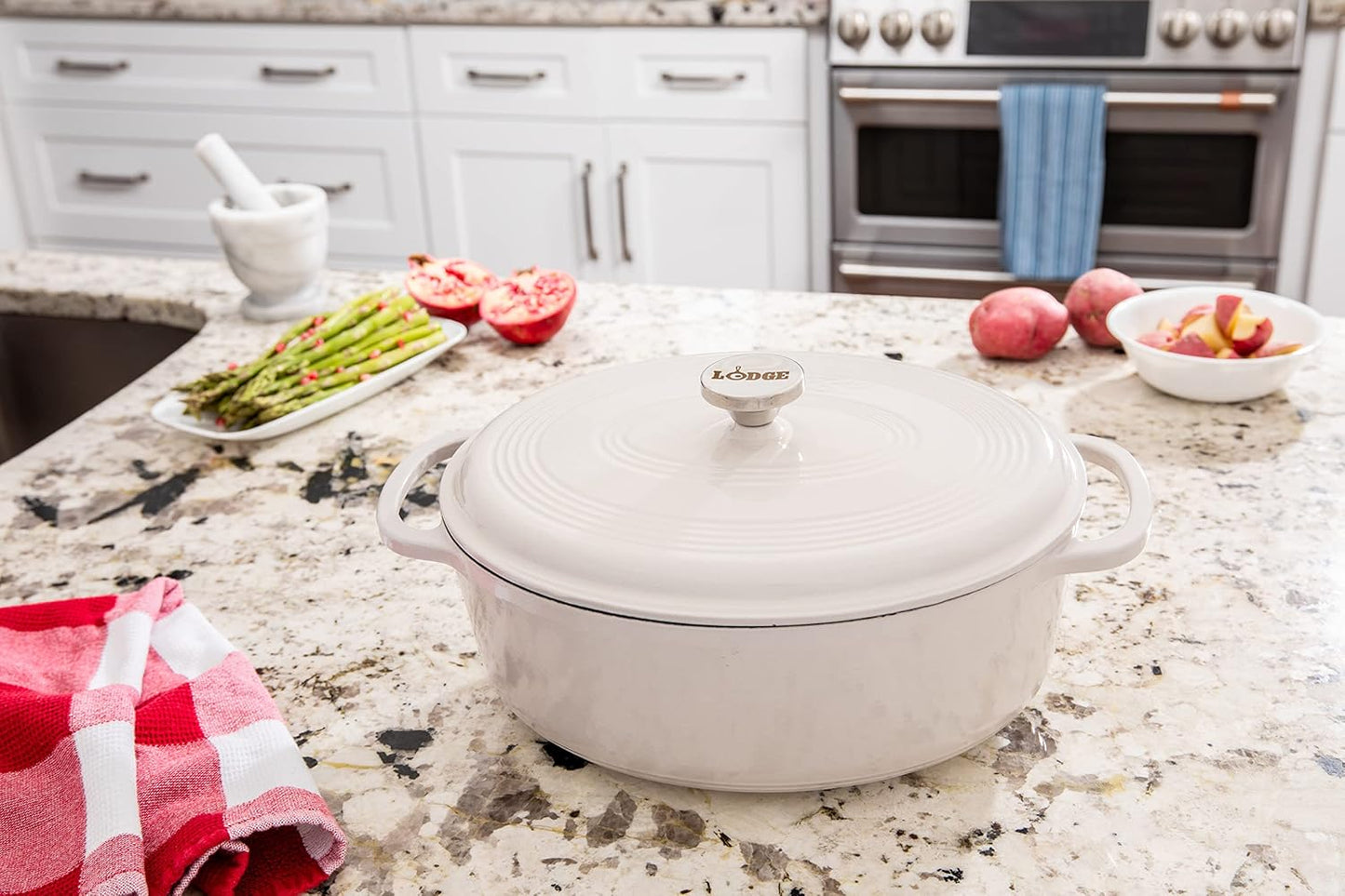 Lodge 7 Quart Enameled Cast Iron Oval Dutch Oven with Lid – Dual Handles – Oven Safe up to 500° F or on Stovetop - Use to Marinate, Cook, Bake, Refrigerate and Serve – Oyster White
