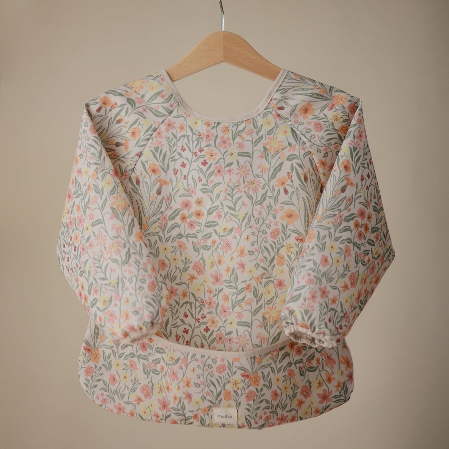 mushie Long Sleeve Baby Bib | Water Resistant Adjustable Fit for Ages 6-24 Months